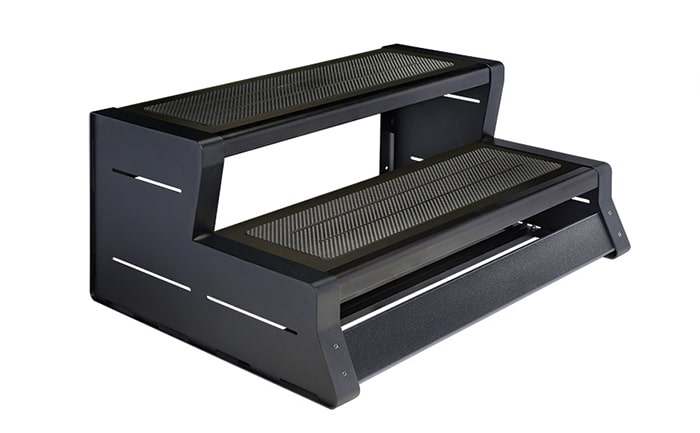 A black step up platform with two steps.