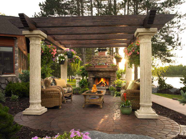 A patio with furniture and a fire pit.