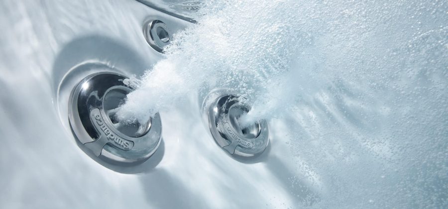 A close up of the water jets on the shower head.