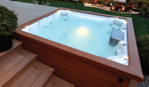 A hot tub with lights on in the middle of it.